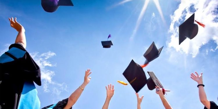 graduation hats in the air