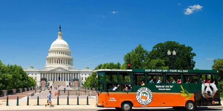 trolley passing by the capital building in Washington, DC